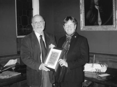 two people holding a gift